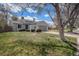 Well-maintained single-Gathering home with a lush lawn, mature trees, and a fenced yard at 17802 E Bates Ave, Aurora, CO 80013