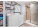 Laundry room has front load washer and dryer, along with a shower stall at 17802 E Bates Ave, Aurora, CO 80013