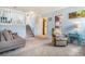 Cozy living room has stairs, with carpeted floors and comfortable seating at 17802 E Bates Ave, Aurora, CO 80013