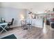 Cozy living room showcases hardwood flooring, ample natural light, and a ceiling fan at 17802 E Bates Ave, Aurora, CO 80013