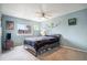 Spacious bedroom featuring neutral carpet, natural light, and a ceiling fan at 17802 E Bates Ave, Aurora, CO 80013