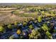 An aerial view showcasing the community, nearby park, and sports fields in a beautiful setting at 9787 W Ohio Ave, Lakewood, CO 80226