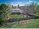 Aerial view of a fenced backyard with mature trees and a well-maintained lawn at 9787 W Ohio Ave, Lakewood, CO 80226