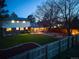 Spacious backyard offering a relaxing hot tub, outdoor dining area, and a well-maintained lawn, ideal for outdoor activities at 9787 W Ohio Ave, Lakewood, CO 80226