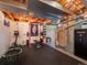 Spacious basement gym equipped with workout gear, lighting, and storage solutions at 9787 W Ohio Ave, Lakewood, CO 80226