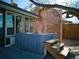 Outdoor hot tub with wooden steps and privacy screening, situated on a patio near the house at 9787 W Ohio Ave, Lakewood, CO 80226
