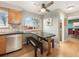 Efficient kitchen with stainless steel appliances, a cozy eat-in nook, and bright lighting at 9787 W Ohio Ave, Lakewood, CO 80226