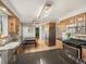 Functional kitchen featuring stainless steel appliances, dark countertops, and casual dining area at 9787 W Ohio Ave, Lakewood, CO 80226