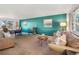 Cozy living room and dining area with a vibrant accent wall and stylish furnishings at 9787 W Ohio Ave, Lakewood, CO 80226