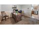 Comfortable home office with a wooden desk, providing an ideal and functional workspace for remote work or study at 9787 W Ohio Ave, Lakewood, CO 80226