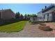 Landscaped backyard with fire pit and access to upper deck at 21518 E Powers Ln, Centennial, CO 80015