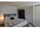 Cozy bedroom with a decorative lamp, comfortable bed, and dresser, offering a relaxing retreat at 21518 E Powers Ln, Centennial, CO 80015