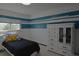 Bedroom featuring white and blue horizontal stripe detail, a light interior and wardrobe at 21518 E Powers Ln, Centennial, CO 80015