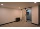 Finished bedroom with neutral carpet and sliding barn door to closet at 21518 E Powers Ln, Centennial, CO 80015