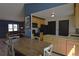 Open-concept dining area leading to the kitchen with ample space for entertaining and Gathering meals at 21518 E Powers Ln, Centennial, CO 80015