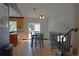 Bright dining area adjacent to the kitchen, featuring hardwood floors and sliding glass doors at 21518 E Powers Ln, Centennial, CO 80015
