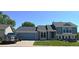 Charming two-story home with blue siding, stone accents, and a well-maintained front yard at 21518 E Powers Ln, Centennial, CO 80015