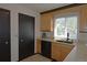 Bright kitchen features stainless steel appliances, granite countertops, and stylish cabinets at 21518 E Powers Ln, Centennial, CO 80015