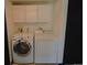 Well-equipped laundry room with a washer, dryer, and overhead storage cabinets at 21518 E Powers Ln, Centennial, CO 80015