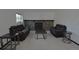 Spacious living room featuring a stone fireplace, neutral carpet, and leather sofas at 21518 E Powers Ln, Centennial, CO 80015