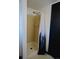 Shower featuring a neutral-tiled shower stall and decorative curtain at 21518 E Powers Ln, Centennial, CO 80015