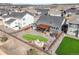 Aerial view of the property featuring an outdoor entertainment area and well-maintained grounds at 15776 Native Willow Dr, Monument, CO 80132
