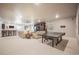 Spacious finished basement with a ping pong table, bar, and comfortable seating area at 15776 Native Willow Dr, Monument, CO 80132
