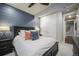 Beautiful bedroom with a modern design featuring blue shiplap accent wall and soft textures at 15776 Native Willow Dr, Monument, CO 80132