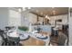 Open-concept dining area with backyard views seamlessly connected to a modern kitchen at 15776 Native Willow Dr, Monument, CO 80132