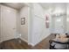 Welcoming home entryway boasting wood floors, accent wall trim and natural light flowing through at 15776 Native Willow Dr, Monument, CO 80132