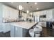 Spacious kitchen with a large center island, pendant lighting, and stainless steel appliances at 15776 Native Willow Dr, Monument, CO 80132