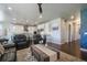 Open-concept living room connected to a modern kitchen, perfect for entertaining at 15776 Native Willow Dr, Monument, CO 80132