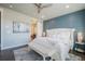 Comfortable bedroom with large bed and a bathroom with sliding door at 15776 Native Willow Dr, Monument, CO 80132