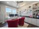 Bright office with built-in shelves, ample natural light, and a stylish contemporary design at 15776 Native Willow Dr, Monument, CO 80132
