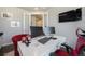 The home office has a built in desk, shelving, a large window, and two computer screens at 15776 Native Willow Dr, Monument, CO 80132