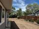 Backyard with wood fence and stone landscaping at 1533 E Harlan, Lakewood, CO 80214