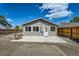 The backyard has a patio, gravel, and newer fencing at 1533 E Harlan, Lakewood, CO 80214