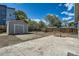 Backyard with a shed, wooden fence, gravel and concrete at 1533 E Harlan, Lakewood, CO 80214