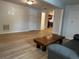 Spacious basement featuring stylish wood flooring, a comfortable seating area, and ample natural light at 1533 E Harlan, Lakewood, CO 80214