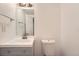 Bright bathroom featuring a modern vanity with updated fixtures and a neutral color palette at 1533 E Harlan, Lakewood, CO 80214