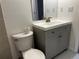 Bathroom with a toilet and sink vanity at 1533 E Harlan, Lakewood, CO 80214
