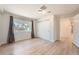 Bedroom featuring a window with curtains, a closet, and light wood floors at 1533 E Harlan, Lakewood, CO 80214