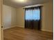 Bedroom with hardwood floors and a window with coverings at 1533 E Harlan, Lakewood, CO 80214