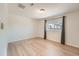 Bedroom featuring a window with curtains, and light wood floors at 1533 E Harlan, Lakewood, CO 80214