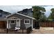 Charming single-story house with well-kept yard and clear 'For Sale' sign at 1533 E Harlan, Lakewood, CO 80214