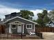 Charming single-story home with gray siding, a well-maintained yard, and a 'For Sale' sign at 1533 E Harlan, Lakewood, CO 80214