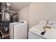 Laundry room with a washer, dryer, and utility sink at 1533 E Harlan, Lakewood, CO 80214