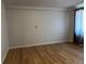 Living room featuring hardwood floors and bright, natural lighting at 1533 E Harlan, Lakewood, CO 80214