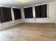 Living room with bright, natural light and unique curtain accents at 1533 E Harlan, Lakewood, CO 80214
