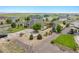 Sprawling property boasts lush landscaping, ample parking, and backyard with pergola at 16231 Rayburn St, Hudson, CO 80642